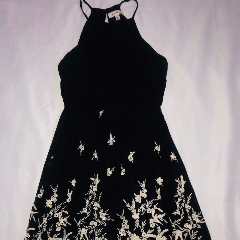 Little black dress with embroidered design.